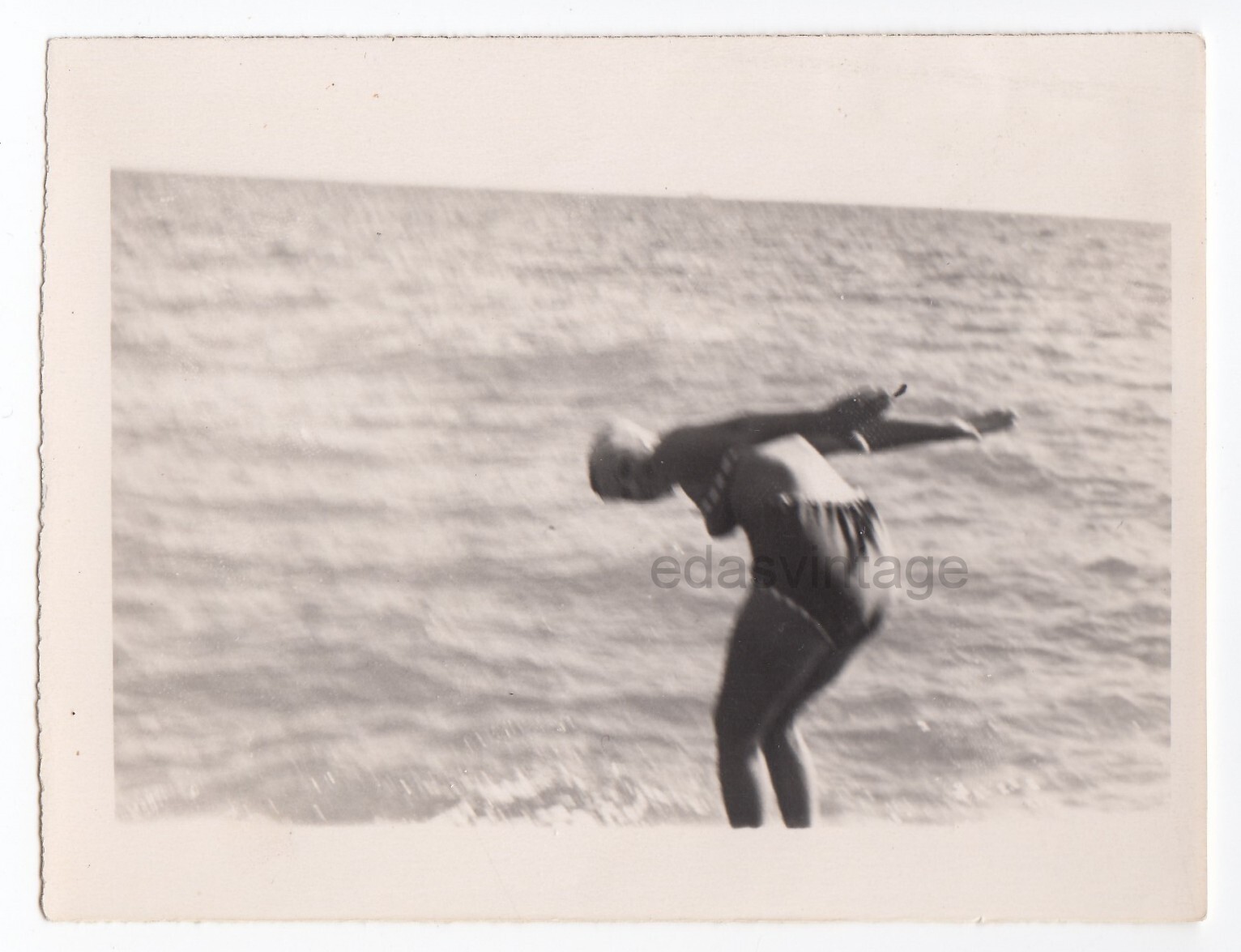 Faceless woman Diver Swimmer Dive shot Rear view Beach Sports Blurred odd photo