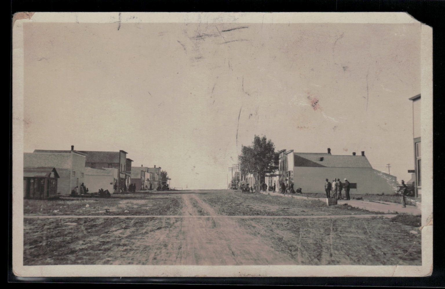 Early 1900s RPPC Main Street Small Town Life Dirt Road & Men Postcard