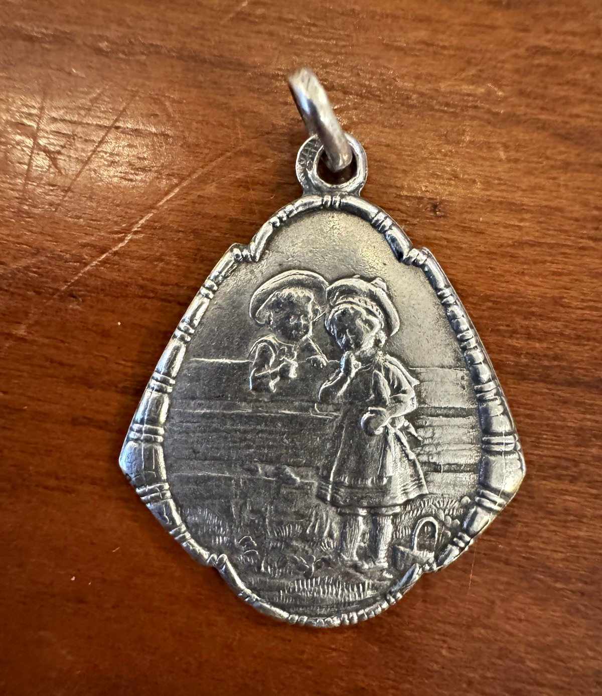 Antique Art Nouveau German Silver Repoussé Sweethearts on Fence Charm or Pendant