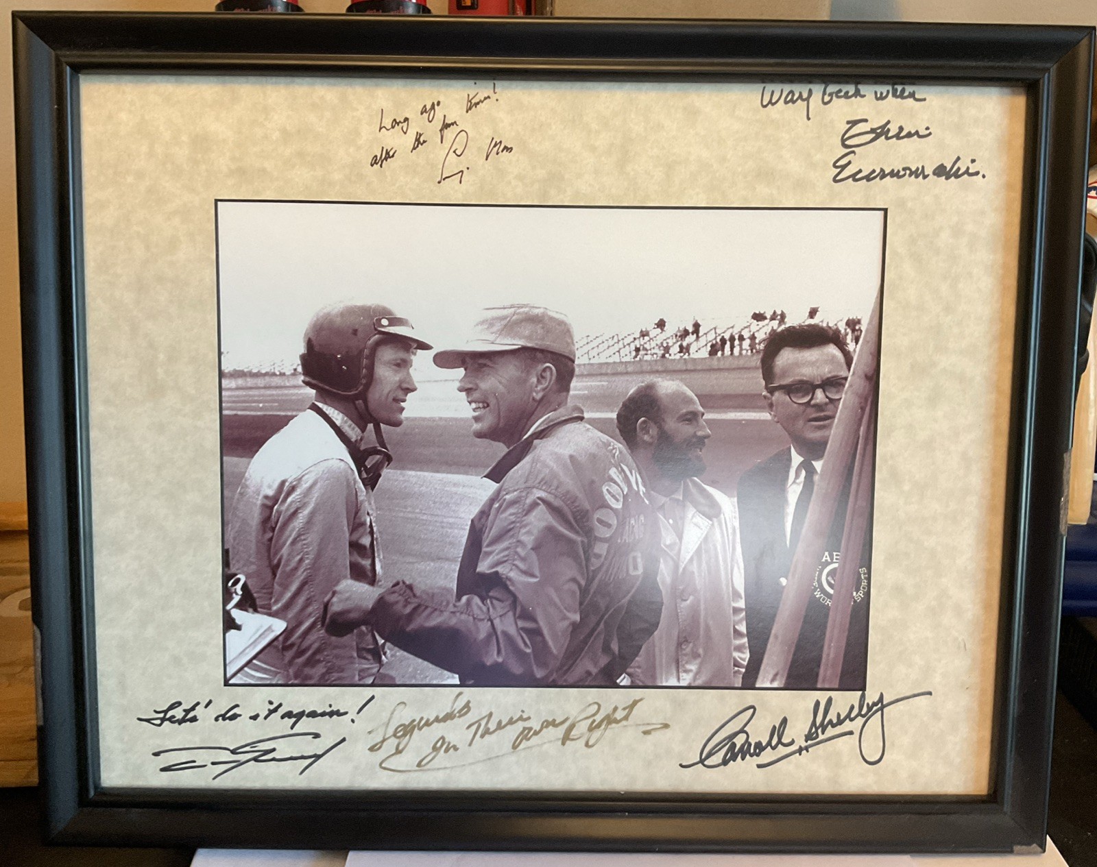 Carroll Shelby, Dan Gurney, Chris Economaki at the racetrack in 1960's Autograph
