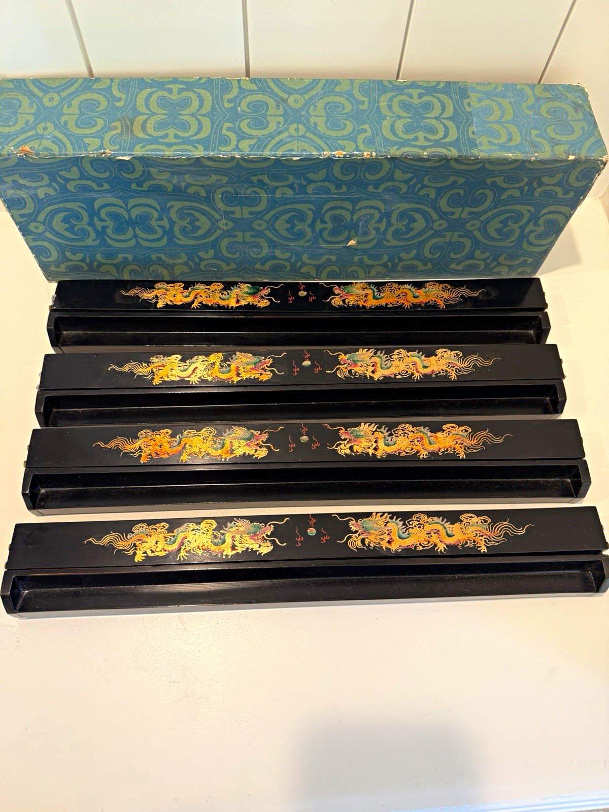  vintage set of four black lacquered and hand-painted Mahjong tile racks 