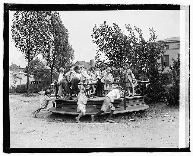 Photo:1910s Children Playground Merry-Go-Round Outdoor Scene