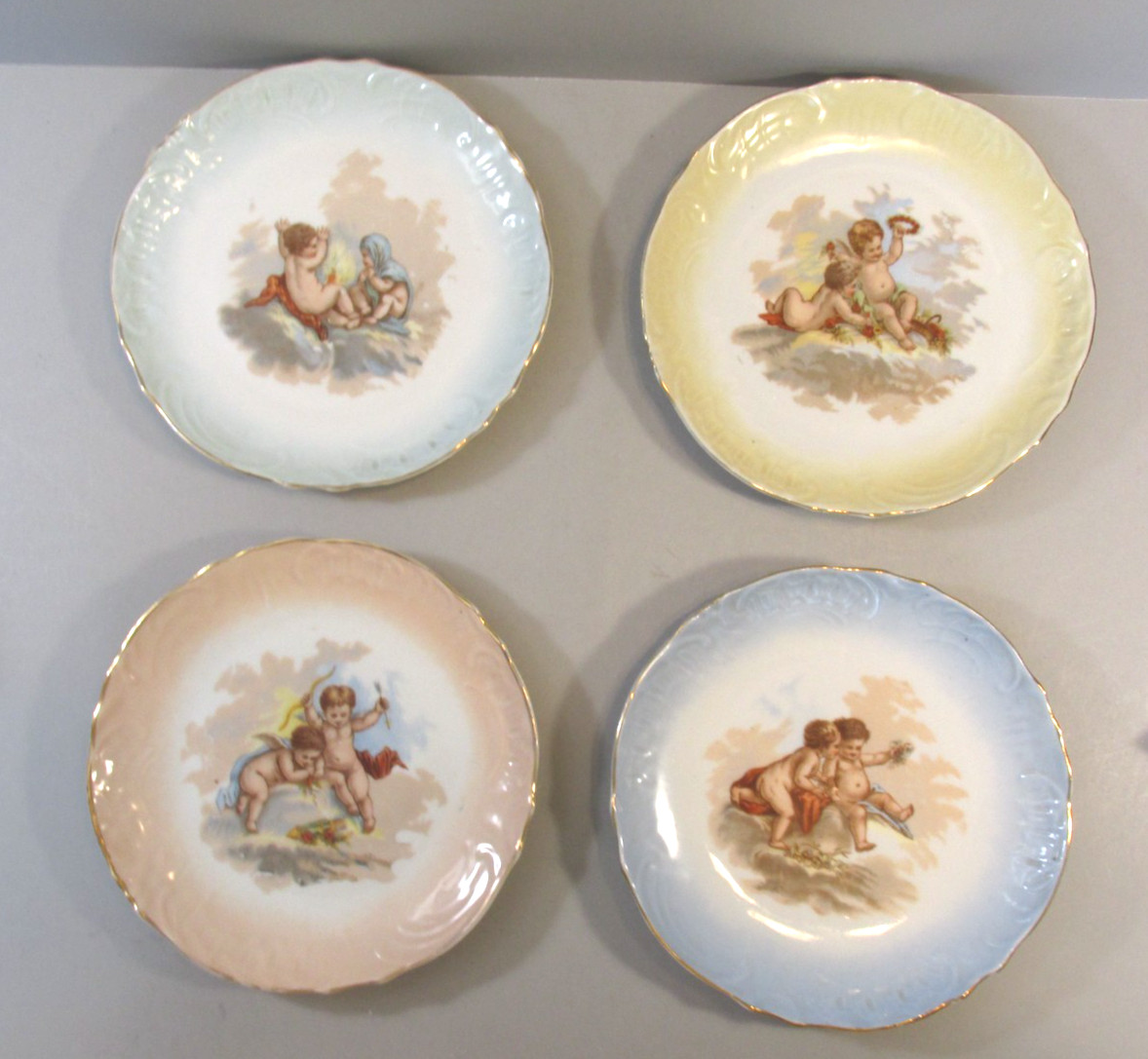 Set of 4 Vintage Decorative Plates with Cherubs Design and Scalloped Edges
