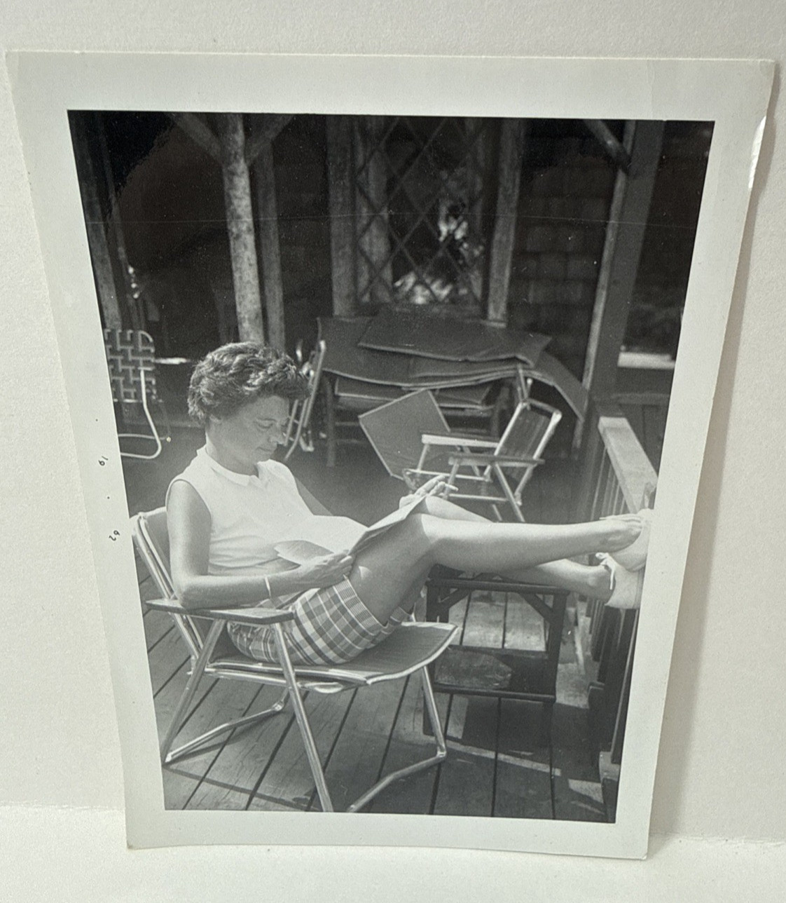 1962 Vintage Snapshot Woman Reading on Porch Mid-Century Leisure Photo Kodak