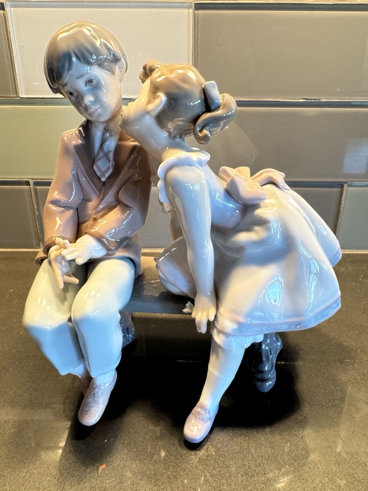 Lladro Porcelain Ten & Growing #7635 Young Girl Kissing Shy Boy on Park Bench