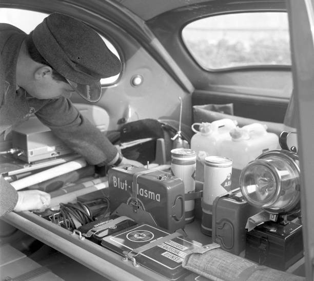 An ADAC member checks his equipment in one of new special cars of - Old Photo