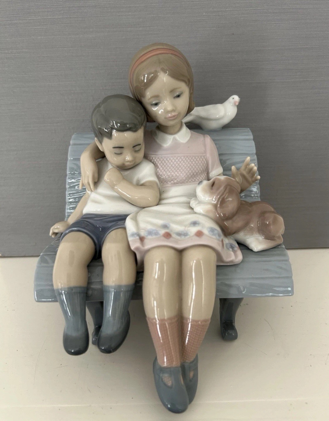 Lladro “Brother and Sister on a Bench with Dog and Bird” Figurine (#6446)