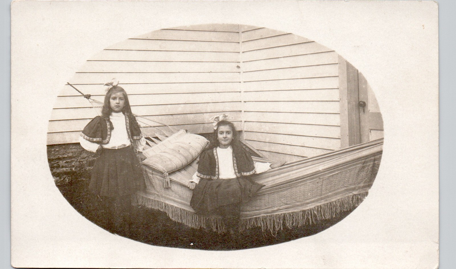 GIRLS IN HAMMOCK c1910 postcard real photo rppc ethnic costume family home