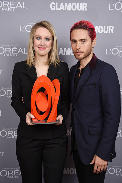 Honoree Elizabeth Holmes poses backstage with her award actor Jare - Old Photo