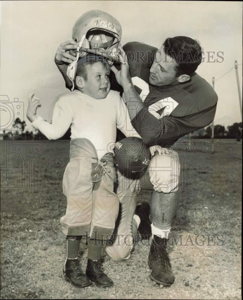 1959 Press Photo Bob Rosbaugh puts helmet on Easter Seal Prince Richard Clark