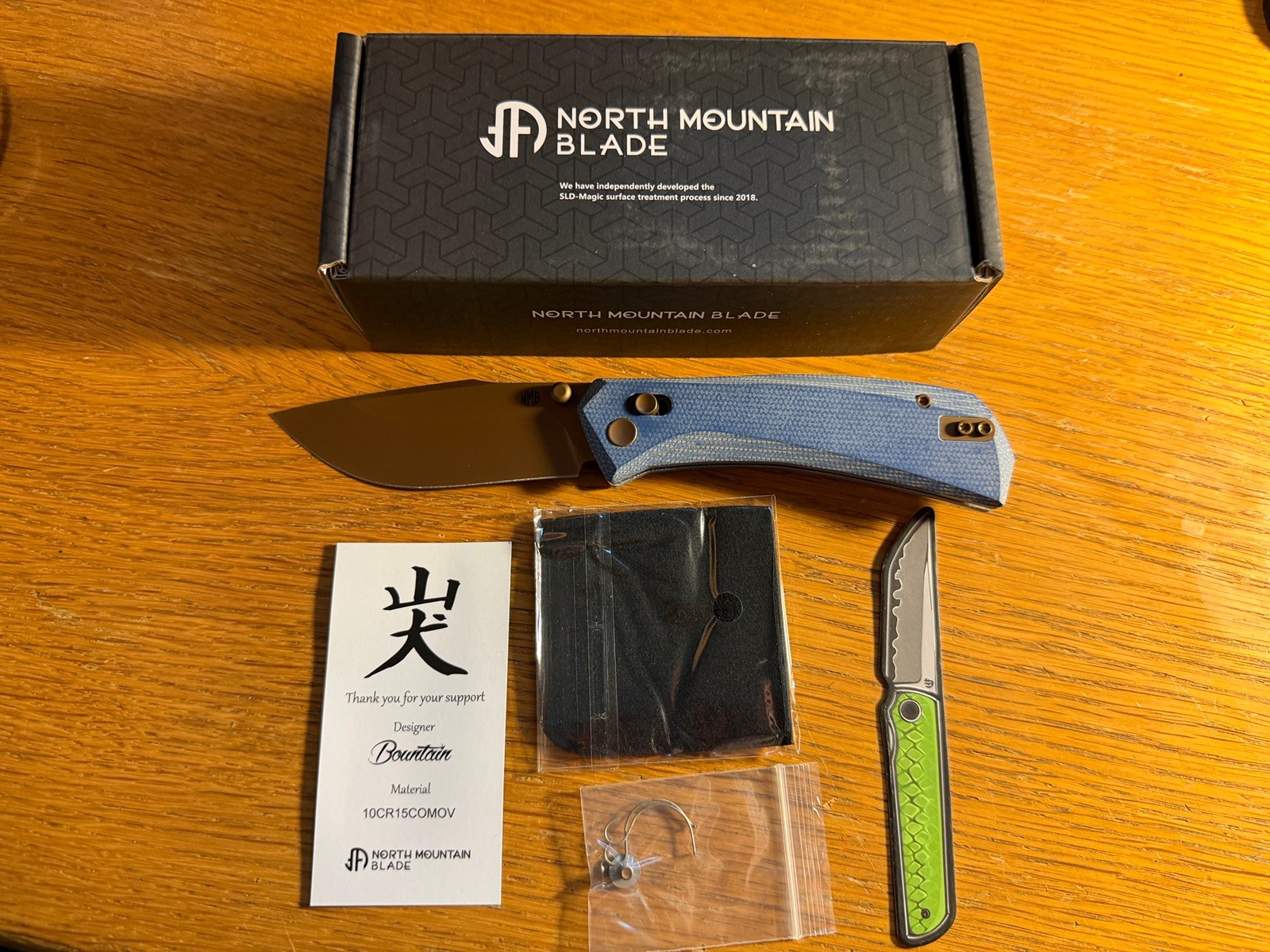 North Mountain Blade Yamainu Blue Micarta Rose Gold Cross Bar Lock 2603-BLMCT