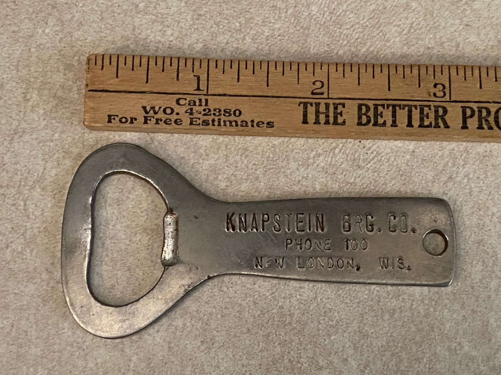 Vtg KNAPSTEiN BRG Co. Phone 100 New London, Wis. BEER BOTTLE OPENER metal RARE