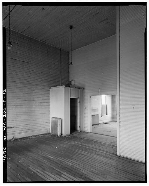12. Interior view room SE corner building behind stage. Camera is pointed SW. -