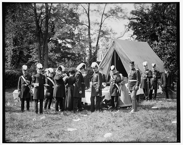 Photo:Military Officers in Uniform by Tent Outdoor Gathering