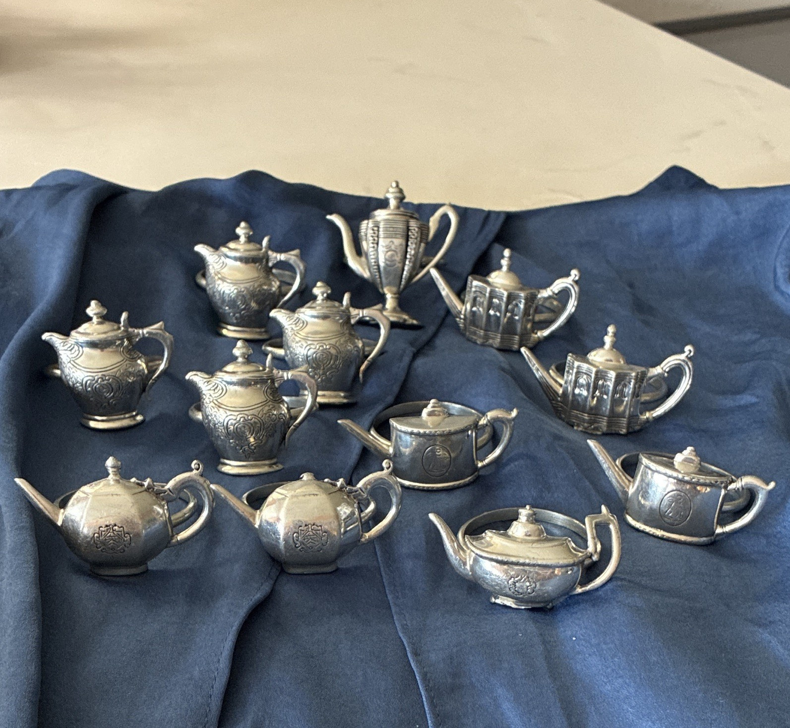 Vintage silver plated set of 12 napkin rings shaped like miniature teapots