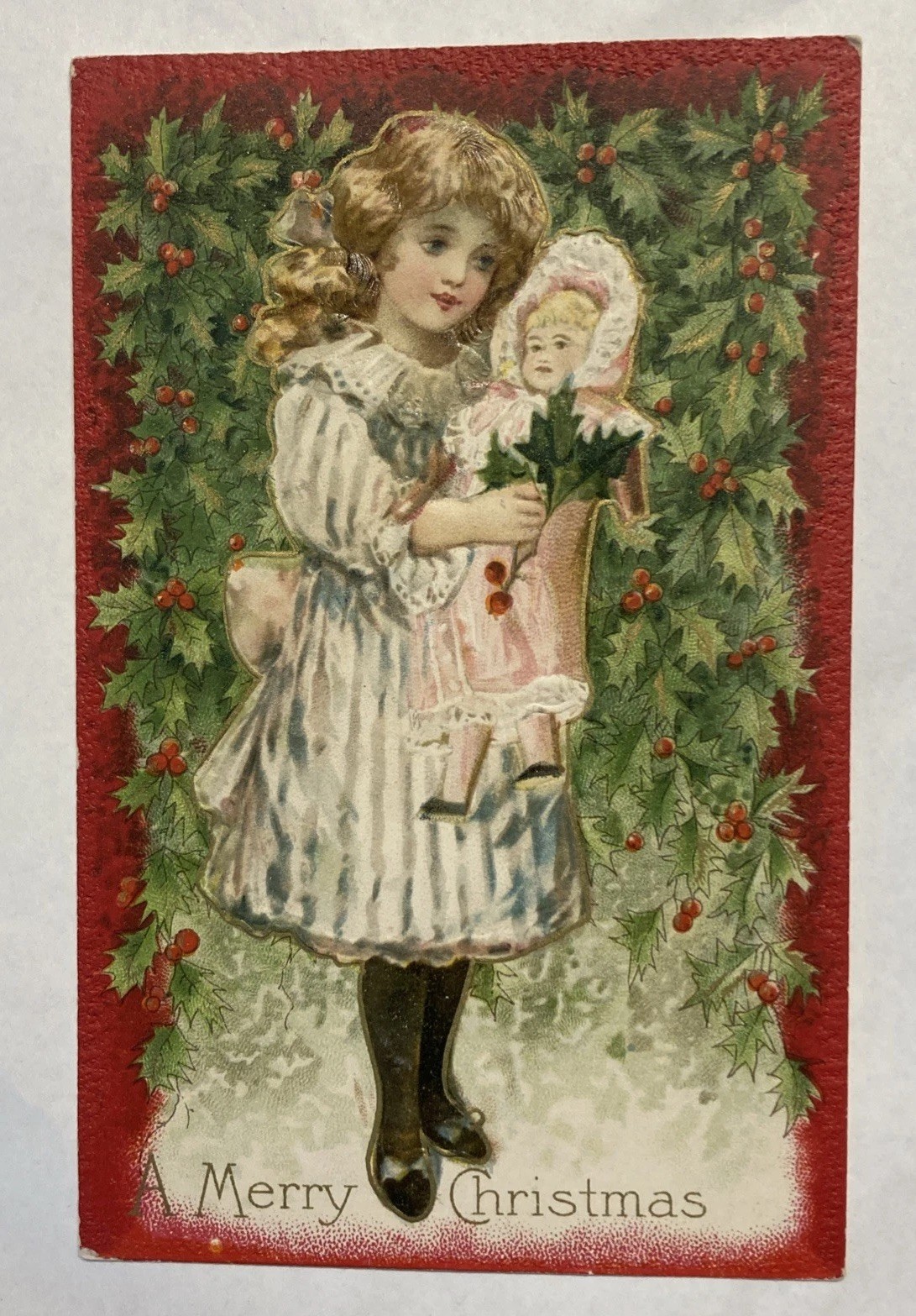 c1910 Merry Christmas Postcard- Little Girl w/ Doll, Holly Berrie - Unused