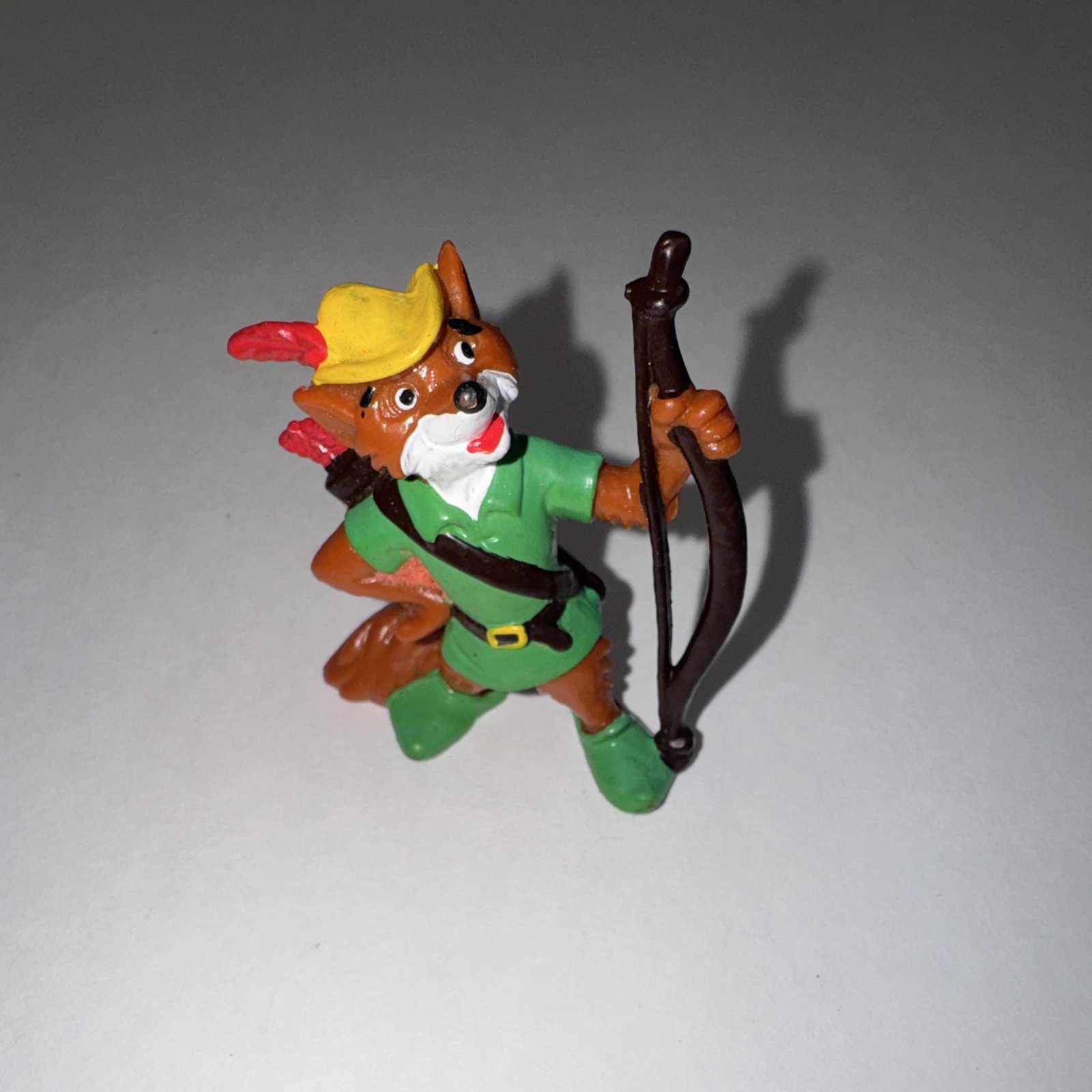 vintage 1982 Disney Robin Hood PVC figure holding his bow