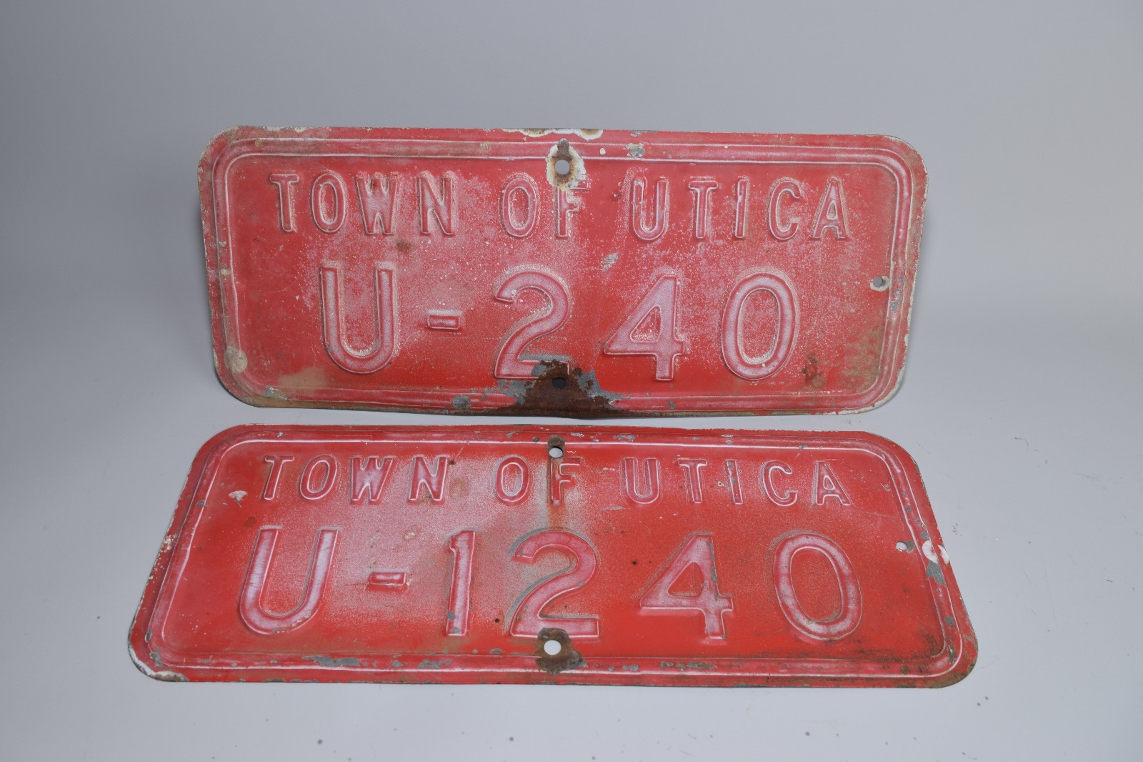 Vintage Town of Utica Metal Fleet Plates U-240 & U-1240 Red Embossed (2)